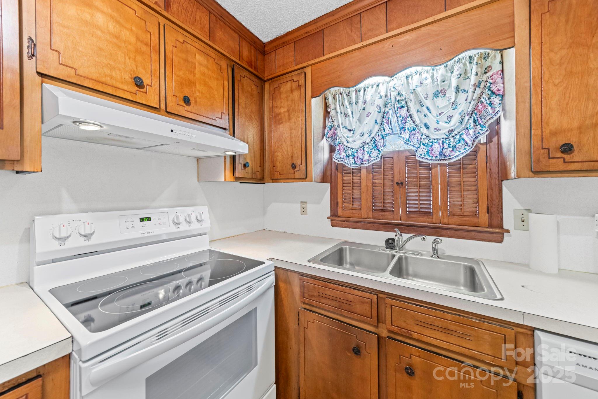 1902 Shady Lane Monroe, NC 28110 - Photo 15 of 36 a kitchen with a stove and a sink