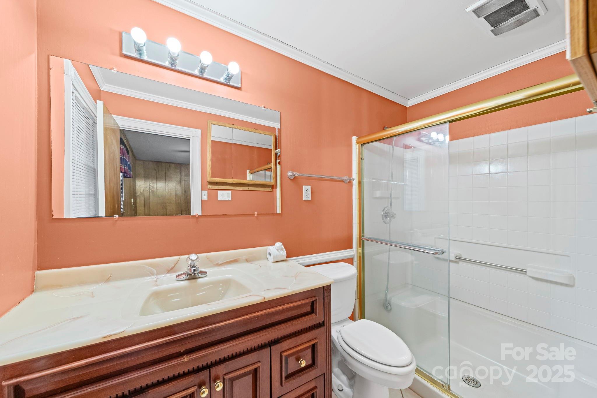 1902 Shady Lane Monroe, NC 28110 - Photo 20 of 36 a bathroom with a sink a toilet and shower