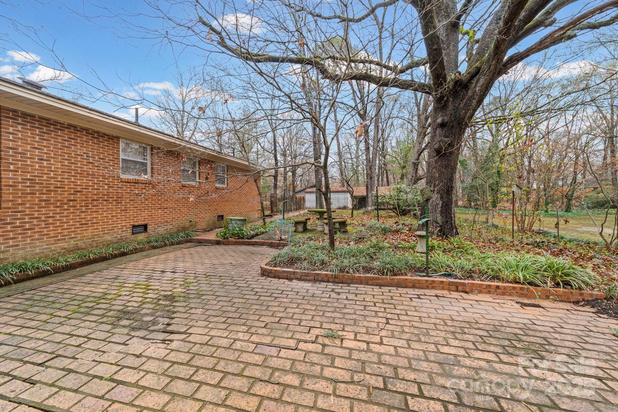 1902 Shady Lane Monroe, NC 28110 - Photo 27 of 36 a backyard of a house with lots of green space