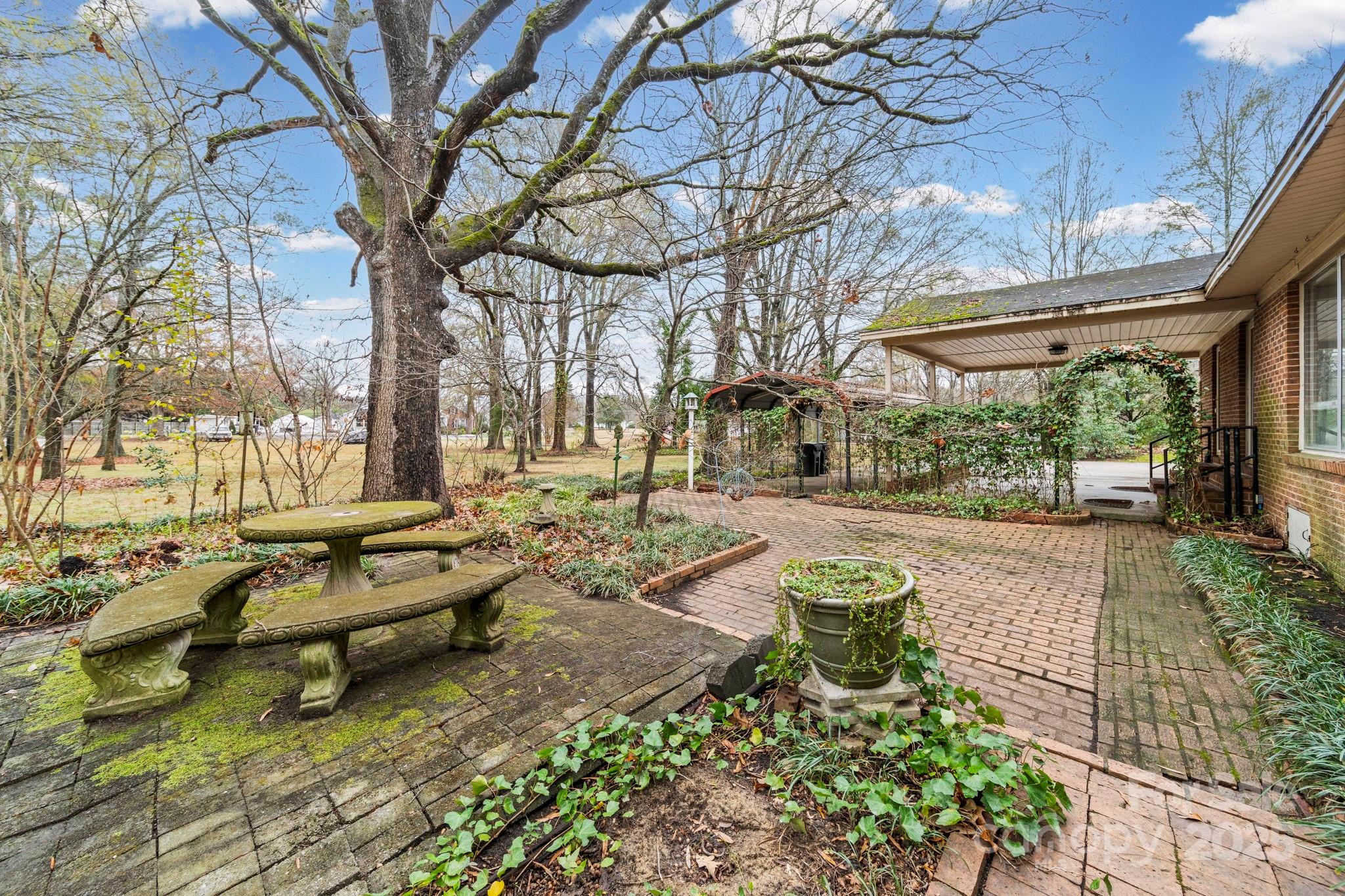 1902 Shady Lane Monroe, NC 28110 - Photo 29 of 36 a garden view with sitting space