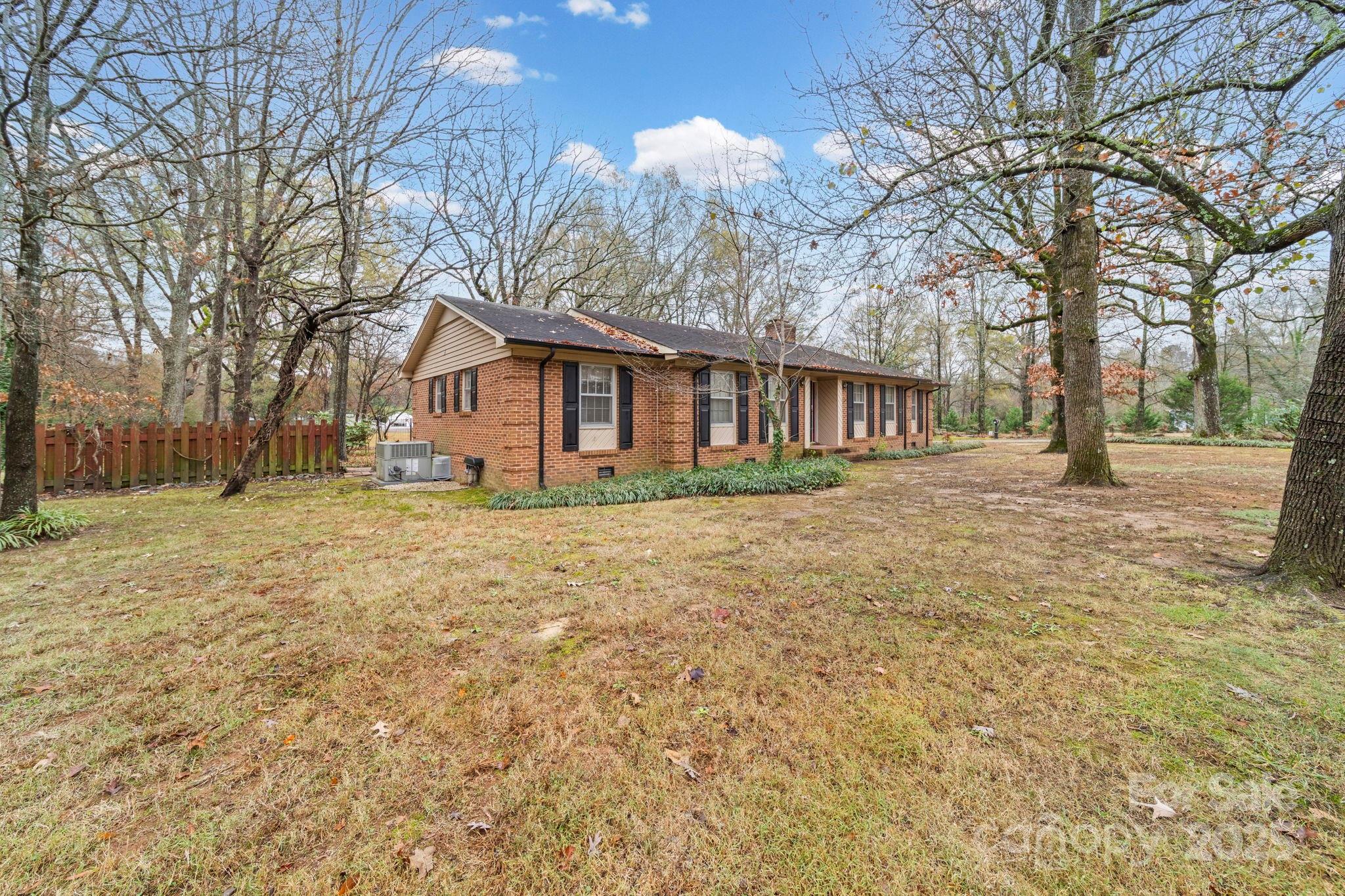 1902 Shady Lane Monroe, NC 28110 - Photo 33 of 36 a front view of house with yard and trees around