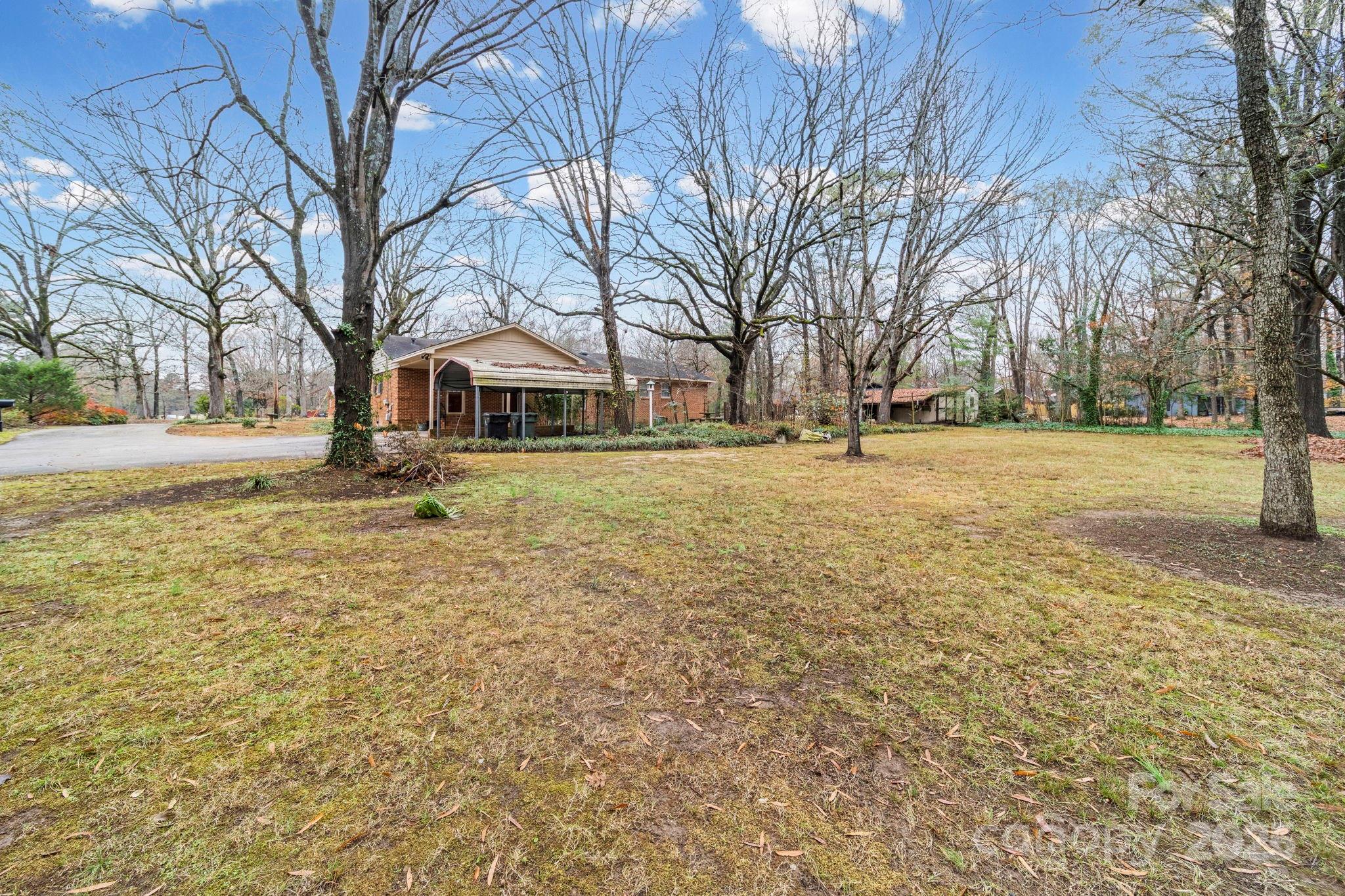 1902 Shady Lane Monroe, NC 28110 - Photo 35 of 36 a front view of a building with large trees