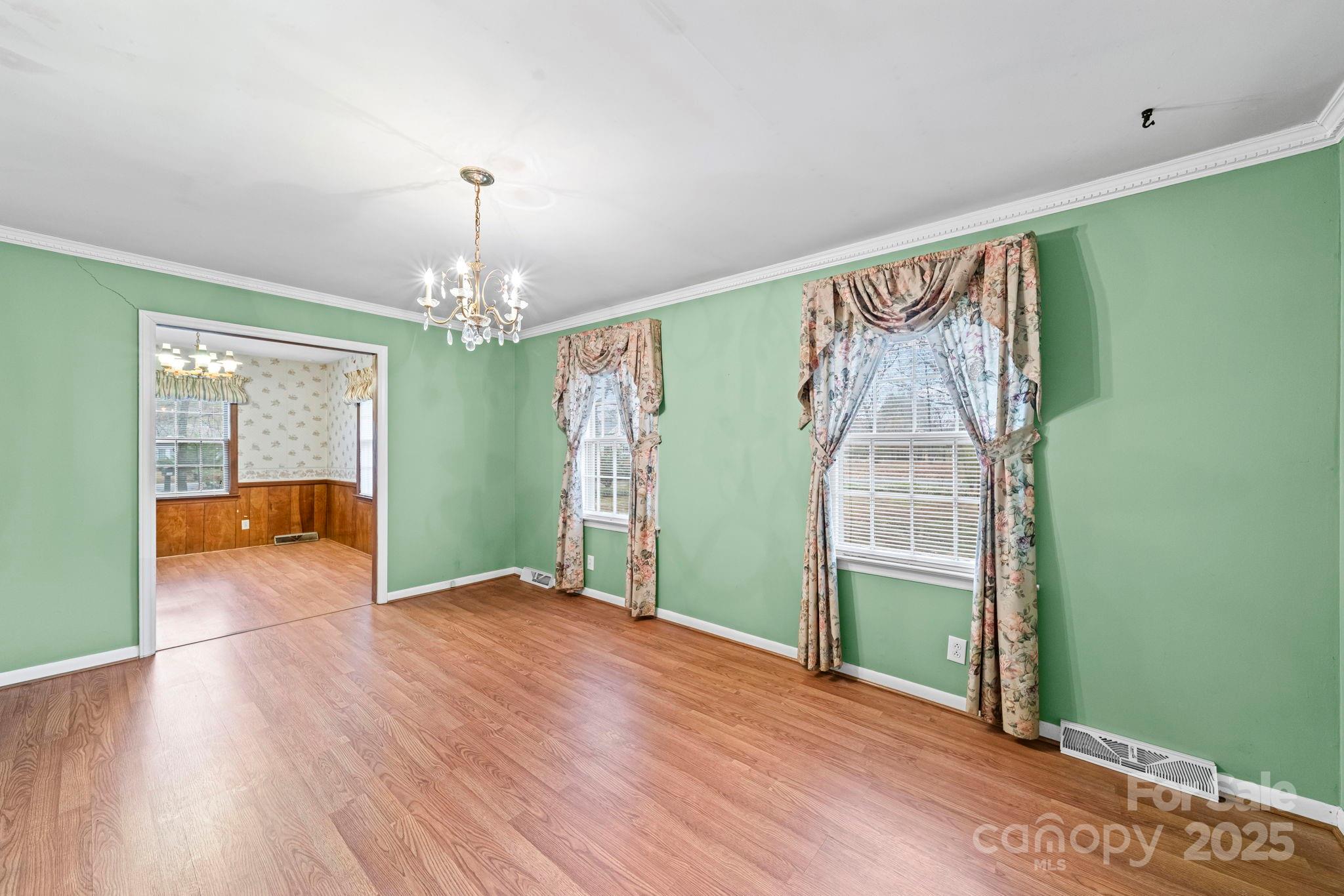 1902 Shady Lane Monroe, NC 28110 - Photo 8 of 36 wooden floor in an empty room with a window