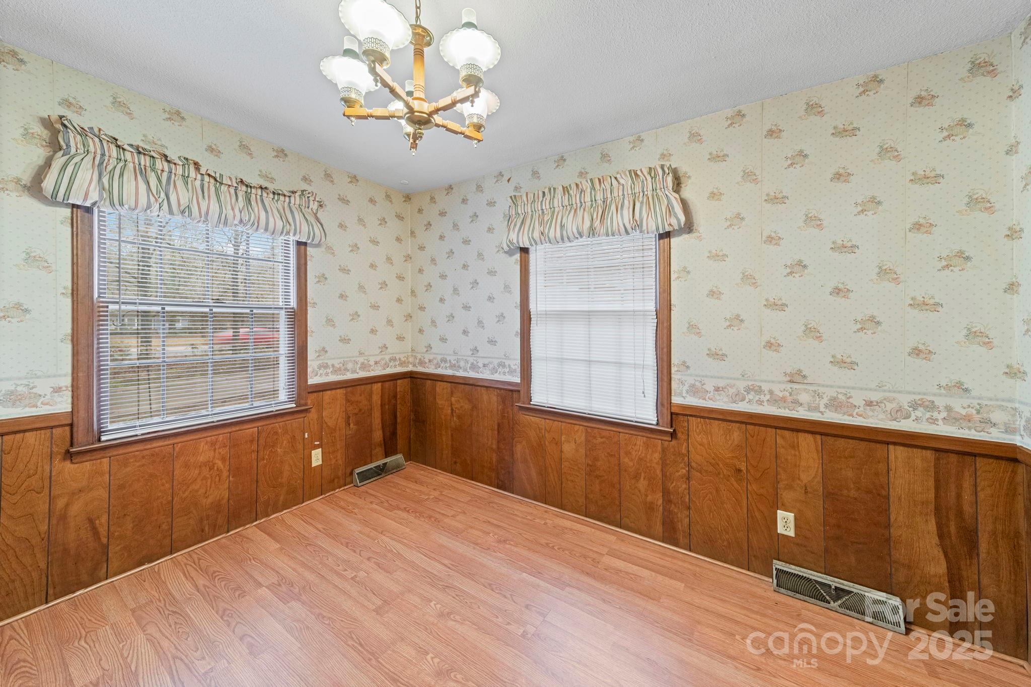 1902 Shady Lane Monroe, NC 28110 - Photo 9 of 36 a view of a livingroom with wooden floor and a window