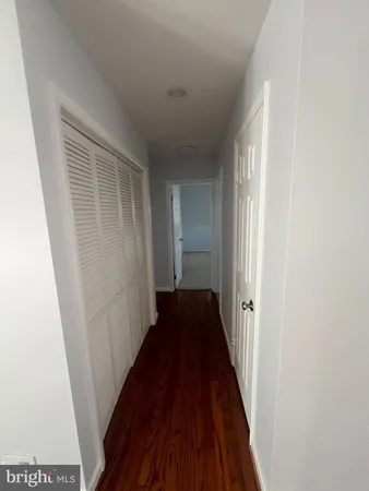 a view of a room with wooden floor and stairs