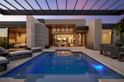 a living room with furniture flat screen tv and a table