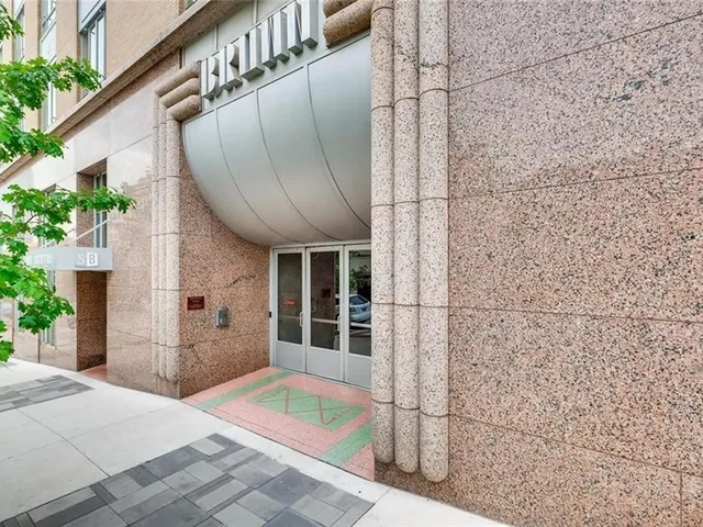 a view of a brick house with a large window