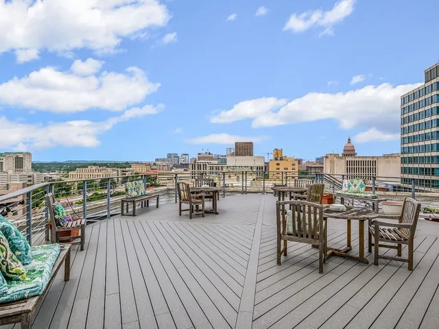 a view of roof deck with patio