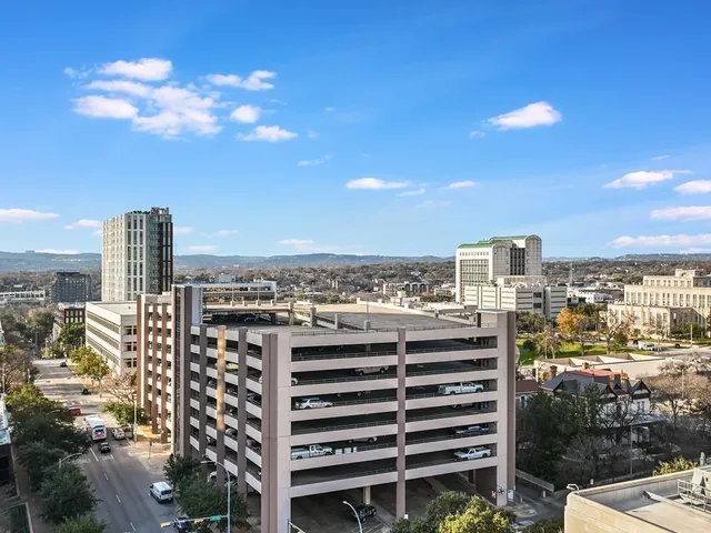 a view of a city with tall buildings