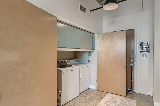 a kitchen with a stove and a refrigerator