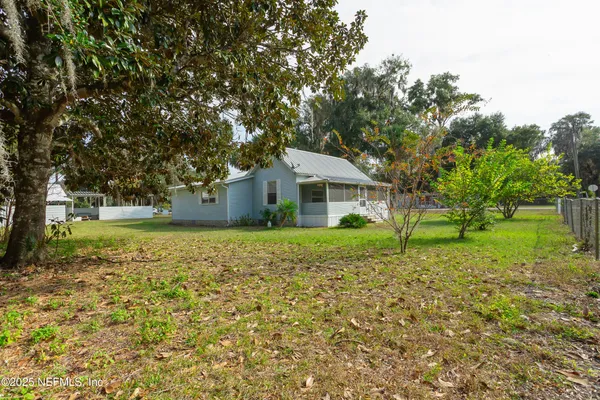 a house with trees in front of it