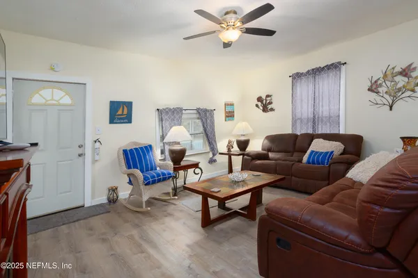 a living room with furniture and a window