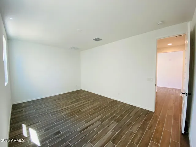 a bathroom with a sink mirror and toilet