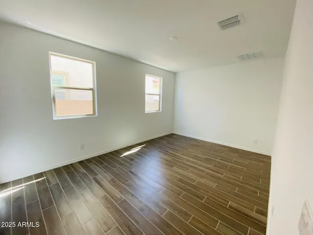 a view of a bathroom from a hallway