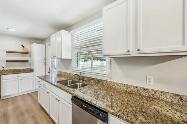a kitchen with granite countertop lots of counter top space