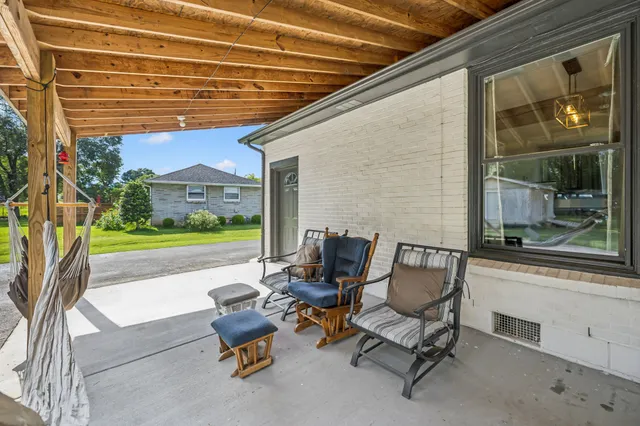 a backyard of a house with seating space