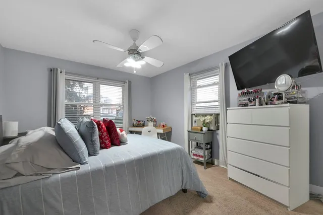 a bathroom with a tub sink toilet and mirror