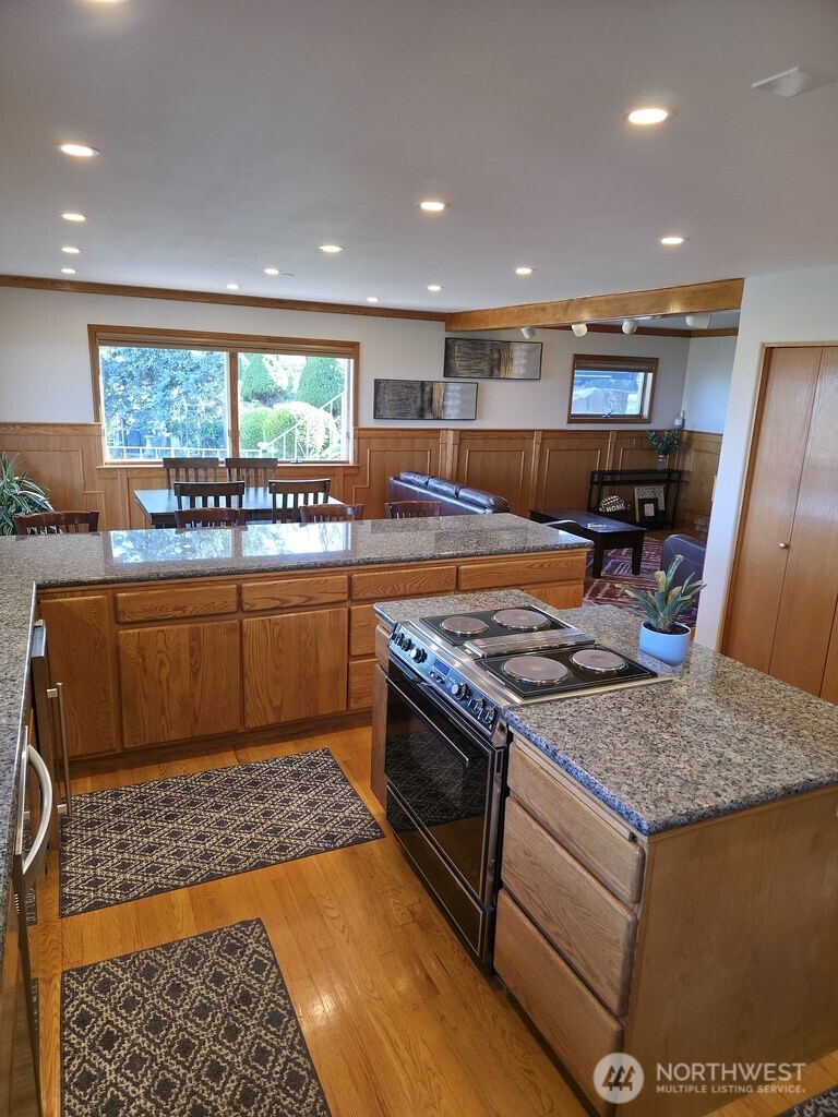 440 West Line Road Ephrata, WA 98823 - Photo 15 of 31 a kitchen with a stove a sink and a refrigerator