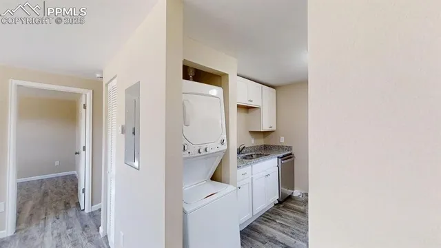 a kitchen with cabinets and stainless steel appliances