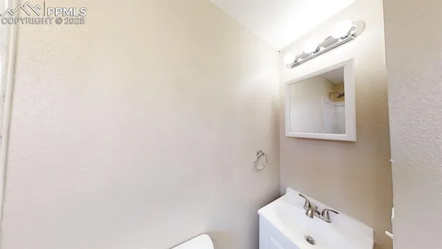 a bathroom with a sink and mirror