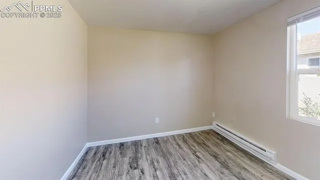 a view of wooden floor in an empty room