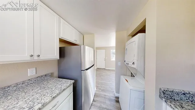a kitchen with a refrigerator and countertop