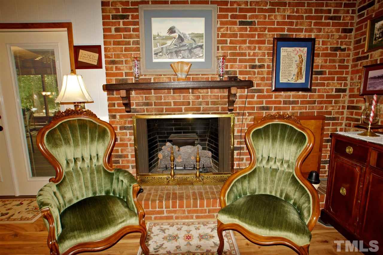 9449 Ferrell Road Zebulon, NC 27597 - Photo 8 of 28 Family room with fireplace...perfect for these chilly nights