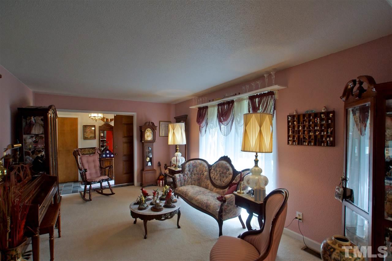 9449 Ferrell Road Zebulon, NC 27597 - Photo 9 of 28 Living Room offers a formal atmosphere to entertain your guests