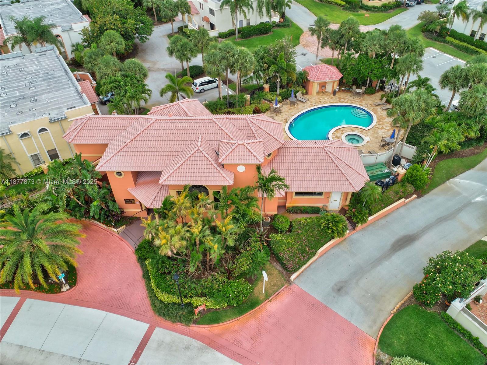 600 Uno Lago Drive, Unit 302 Juno Beach, FL 33408 - Photo 11 of 11 an aerial view of a house with yard