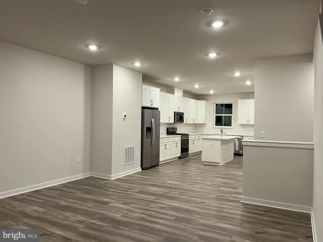 a view of kitchen with wooden floor
