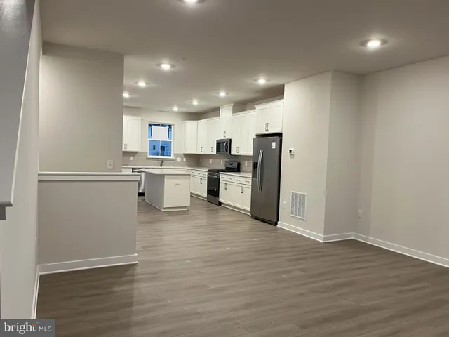 a view of kitchen with wooden floor