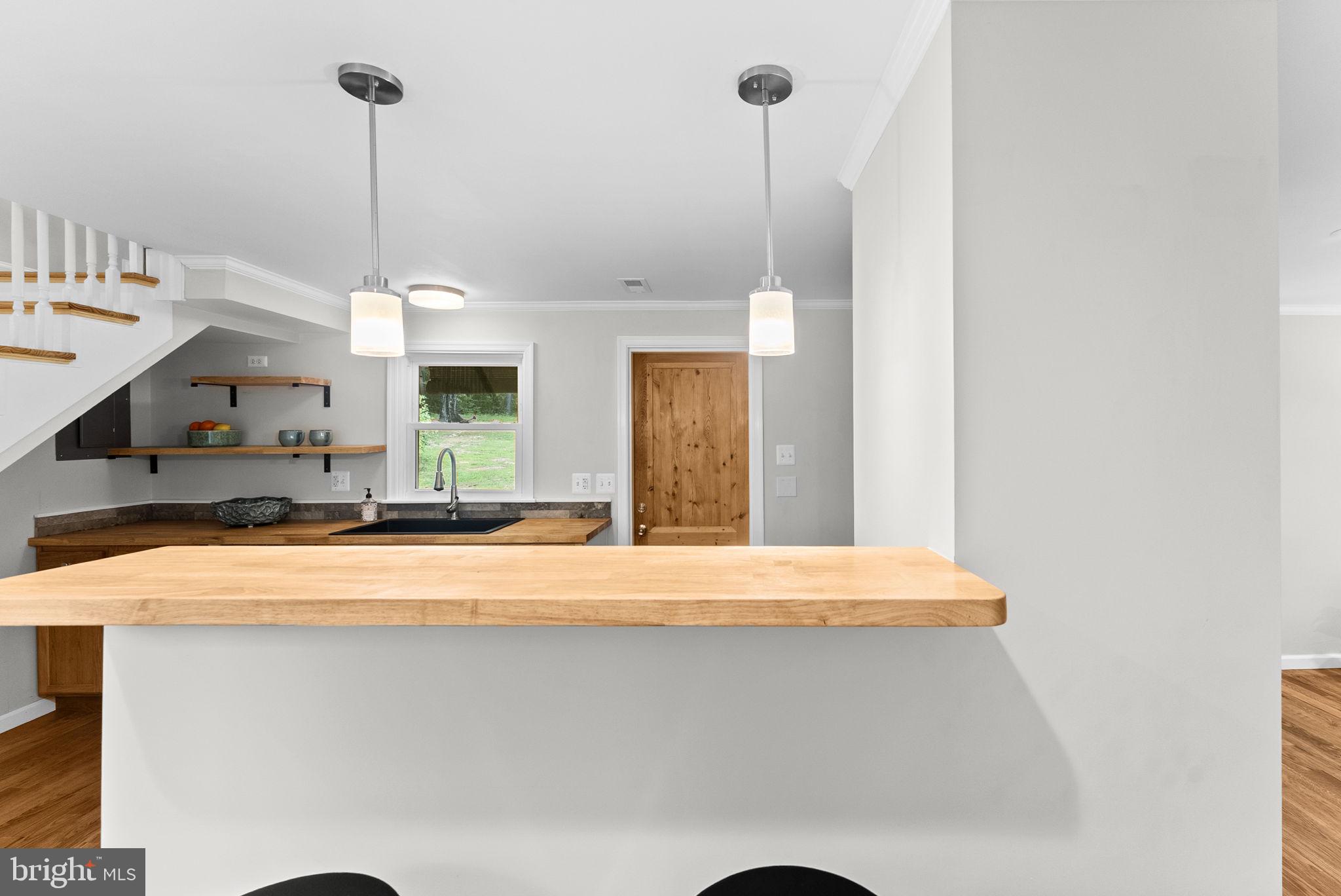 2303 West Hoover Road Haywood, VA 22722 - Photo 12 of 69 Sweet Breakfast Bar with Pendant Lighting