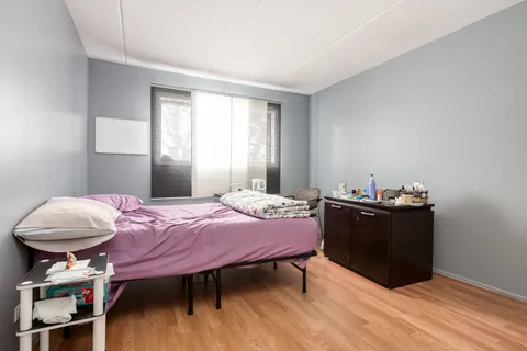 a bedroom with a bed and a closet