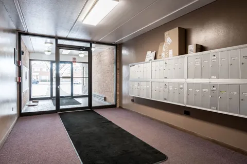 a view of a room with gym equipment and a window