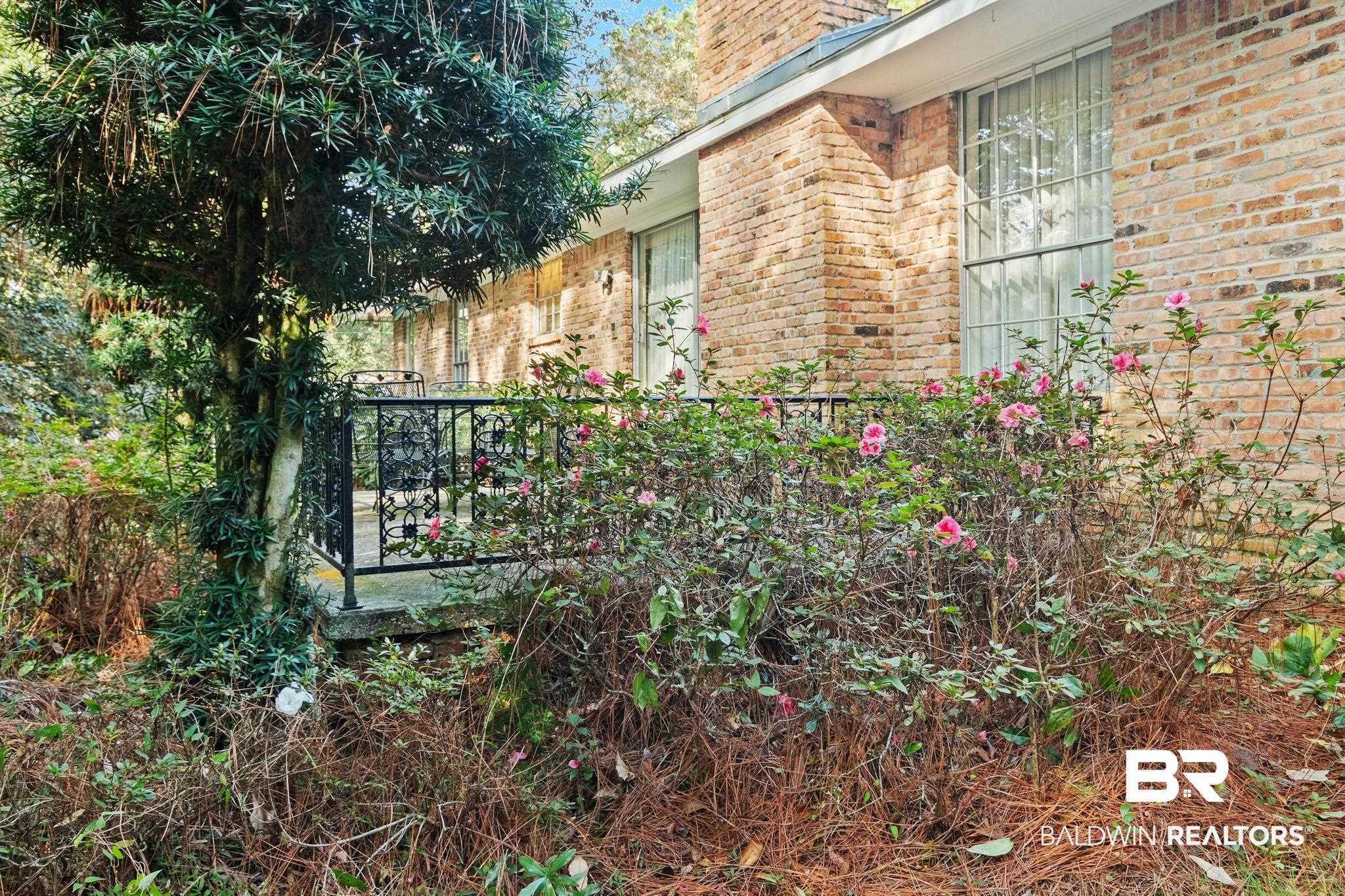 752 Evergreen Street Fairhope, AL 36532 - Photo 64 of 100 View of property exterior featuring brick siding