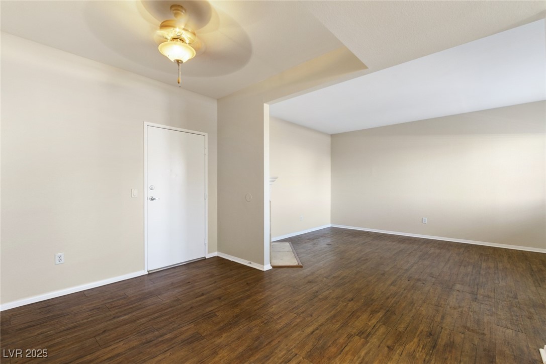 5250 South Rainbow Boulevard, Unit 1097 Las Vegas, NV 89118 - Photo 8 of 10 Spare room with dark wood-type flooring and ceiling fan