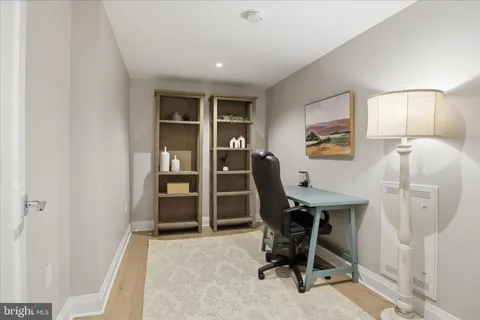 a view of a storage and utility room with washer and dryer