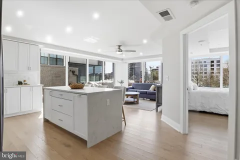 a kitchen with stainless steel appliances a sink stove and refrigerator