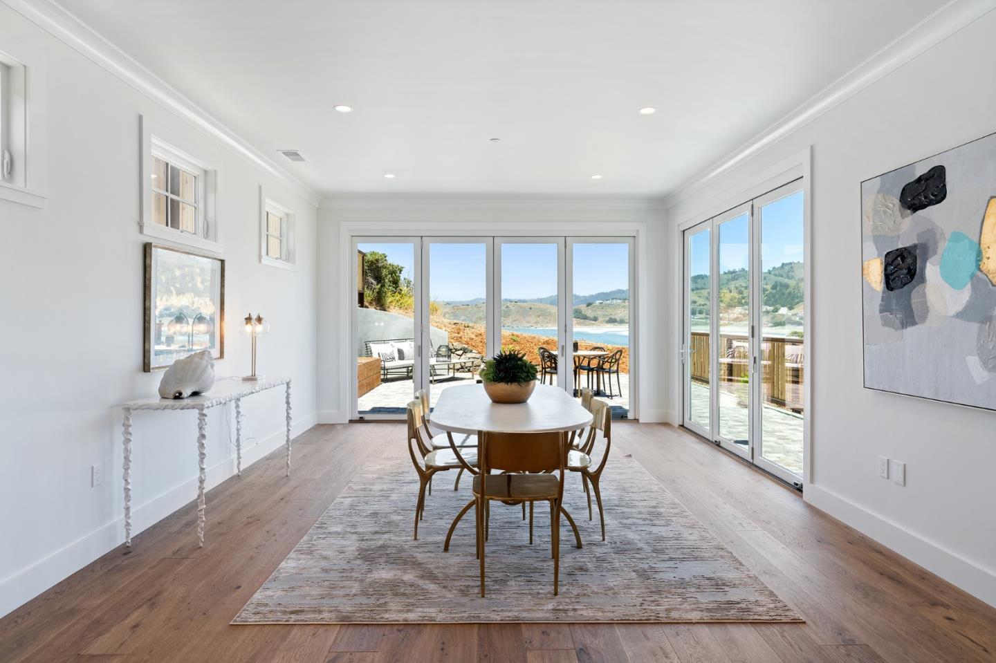 277 Kent Road Pacifica, CA 94044 - Photo 28 of 88 a dining room with furniture a rug and wooden floor