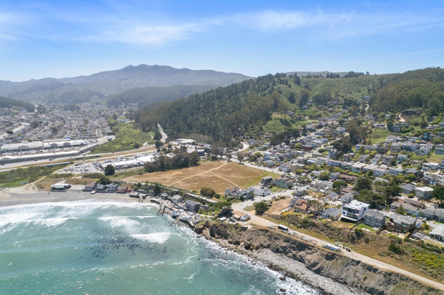 277 Kent Road Pacifica, CA 94044 - Photo 3 of 88 a view of a town with mountains