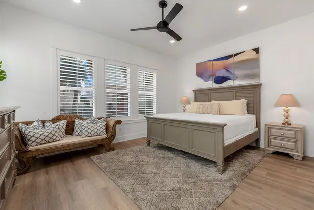 a living room with furniture and floor to ceiling window
