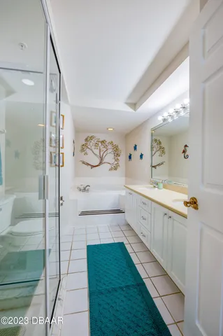 a bathroom with a bathtub and a sink