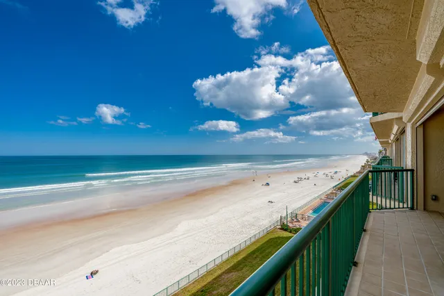 a view of a balcony with a ceiling fan