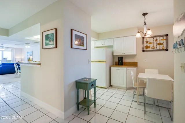 a kitchen with stainless steel appliances a refrigerator sink and microwave