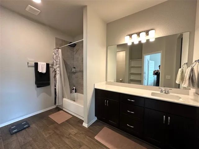 a view of a bathroom with a toilet and a shower