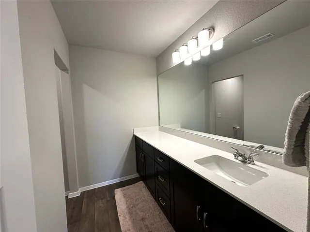 an empty room with a empty space and windows