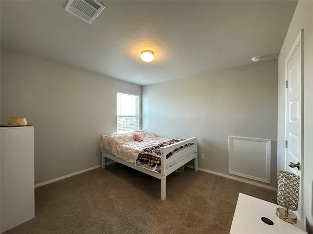 a white toilet sitting next to a bath tub