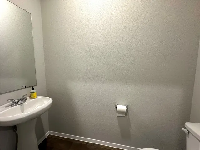 a bathroom with a sink and mirror