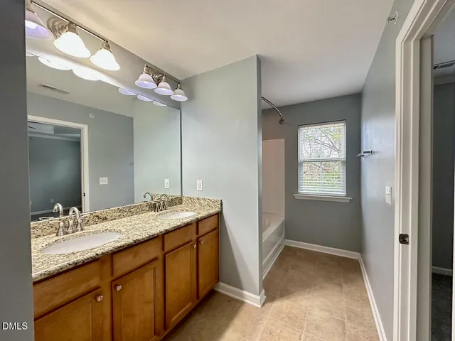 a bathroom with a sink a vanity and a mirror