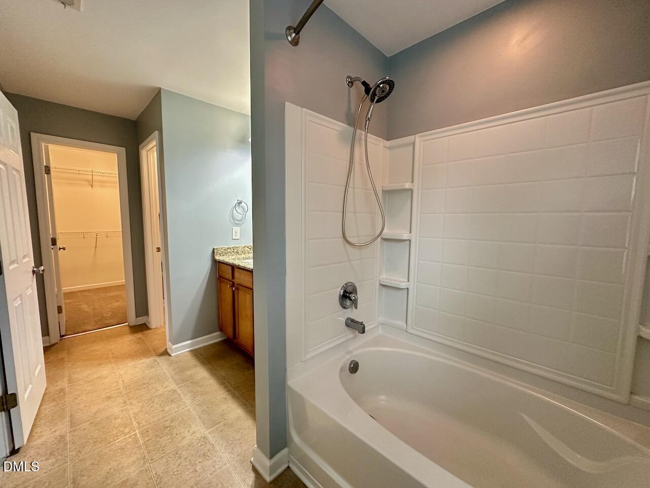 2705 Casper Creek Lane Raleigh, NC 27616 - Photo 19 of 35 a bathroom with a bathtub and a shower
